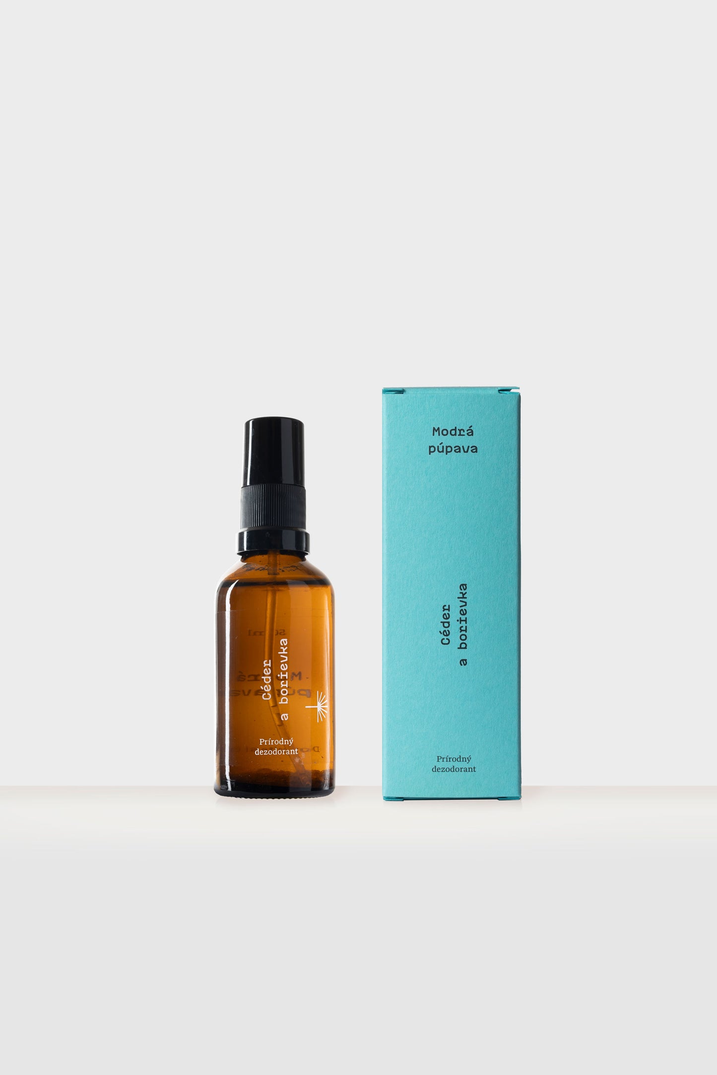 Prírodný deodorant Céder a borievka Modrá púpava v sklenenej fľaštičke so sprejom a papierovej krabičke